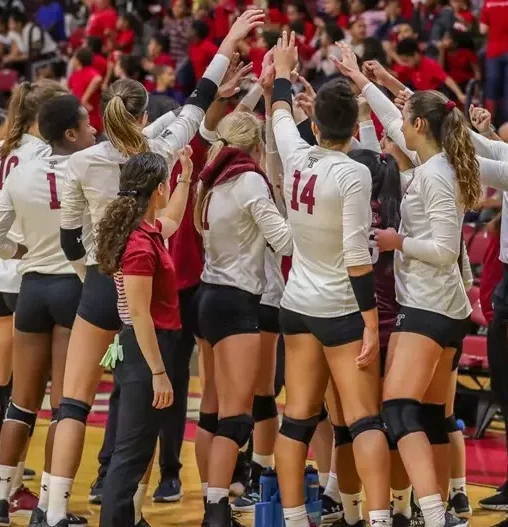 One team, one goal: the power of the huddle Made Scholarships athlete Selina Merfol in a team huddle with her Temple University teammates, where strategy and team spirit are key.