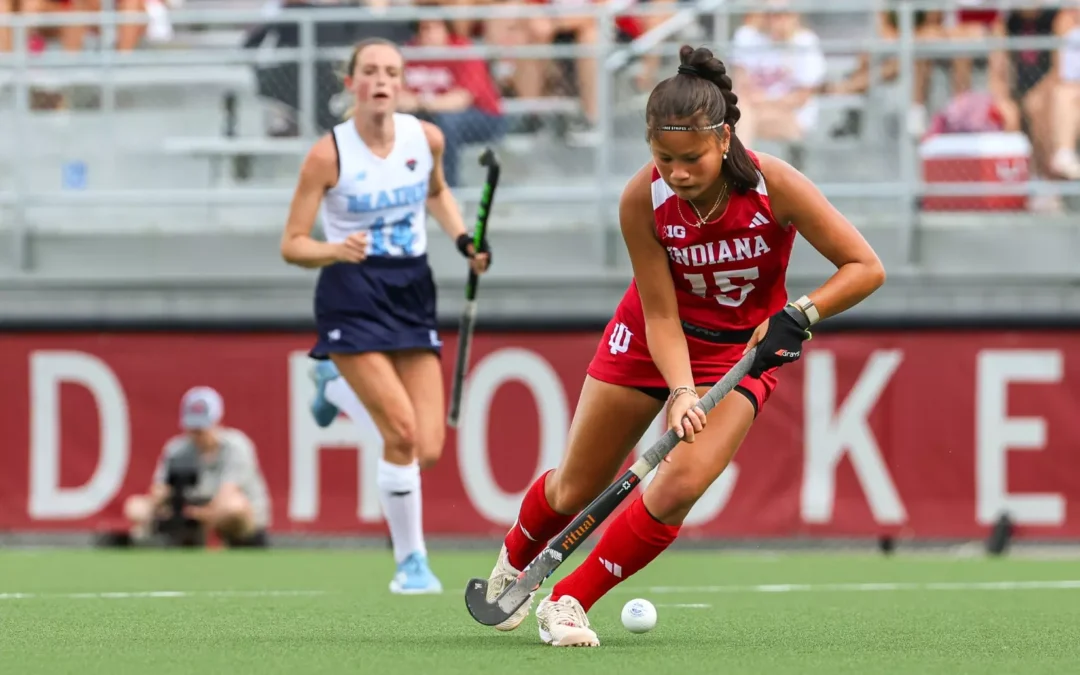 Made Scholarships athlete Yip van Wonderen dribbles for her team, Indiana University, in a competitive college field hockey game.